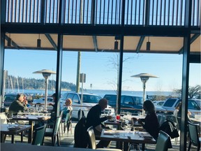 Looking out to the patio and West Vancouver’s waterfront at Ancora Ambleside.