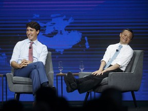 Jack Ma, chairman of Alibaba Group Holding Ltd., right, and Justin Trudeau, Canada's prime minister, react during the Gateway '17 Canada conference in Toronto, Ontario, Canada, on Monday, Sept. 25, 2017. Ma has come under fire his comments supporting a 12-hours-a-day, six-days-a-week work schedule.