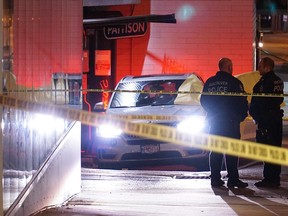 Vancouver police at the scene of a deadly shooting at 4th and Burrard on Tuesday night.