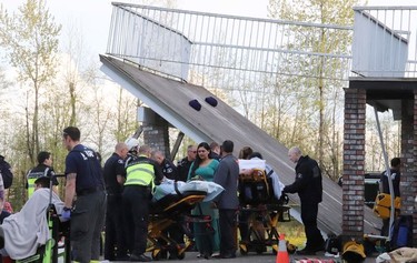 First responders attend the scene of a deck collapse in Langley, B.C. on Friday April 19, 2019.