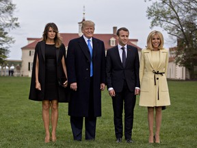 U.S. First Lady Melania Trump, from left, U.S. President Donald Trump, Emmanuel Macron, France's president, and Brigitte Macron, France's first lady, stand for photographers outside the Mansion at the Mount Vernon estate of first U.S. President George Washington in Mount Vernon, Virginia, U.S., on Monday, April 23, 2018.