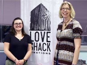 Student Melissa Ayling, left, and Prof. Marie Hopwood with a poster for Qualicum Beach brewer Love Shack Libations. Photo courtesy of Annette Lucas