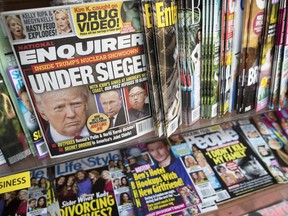 This July 12, 2017 file photo shows an issue of the National Enquirer featuring President Donald Trump on its cover at a store in New York. The parent company of the National Enquirer said Wednesday, April 10, 2019, that it is exploring the publication's possible sale as part of a "strategic review" of its tabloid business.