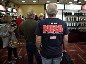 Attendees browse merchandise ahead of the National Rifle Association (NRA) annual meeting at the Indiana Convention Center in Indianapolis, Indiana U.S., on Thursday, April 25, 2019.