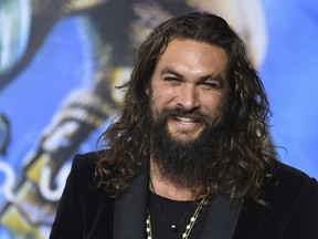 FILE - In this Dec. 12, 2018 file photo, Jason Momoa arrives at the premiere of "Aquaman" at TCL Chinese Theatre in Los Angeles. Momoa on Wednesday, April 17, 2019 released a video in which he shaved off his signature beard and mustache in order to promote recycling. He started by saying farewell to his "Game of Thrones" and DC characters Drogo and Arthur Curry. Momoa said he thought he last shaved in 2012.