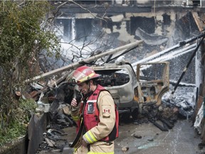 Two people were taken to hospital with smoke inhalation after a fire engulfed a house, and damaged a neighbouring home, in the 3700-block of E. Pender Street in Burnaby, BC early Friday morning April 19, 2019. Burnaby Fire Department crews battled the blaze for hours.