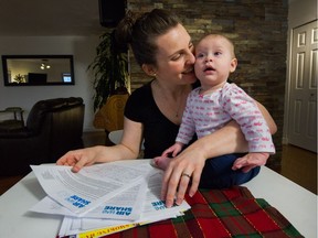 Langley mom Naomi Baker and her 10-month-old daughter Faith delivered a 17,000-signature petition to the B.C. legislature on Thursday in her quest to ban smoking from multi-unit strata buildings.