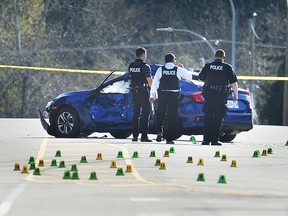 RCMP on the scene of a shooting on 100 Ave near 156 St, in Surrey, April 2, 2019. Police responded to reports of shots fired at about 9 p.m. Monday in Surreyís Guildford neighbourhood. Two men were sent to hospital with gunshot wounds following the incident.