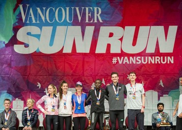 The top six finishers (left to right): Natasha Wodak, Kinsey Middleton, Malindi Elmore, Haron Sirma, Trevor Hofbauer and Justin Kent after the 35th annual Vancouver Sun Run in Vancouver on Sunday, April 14, 2019.