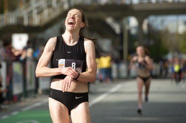 Shalaya Kipp of Vancouver looks spent as she crosses the finish line at the annual Vancouver Sun Run in Vancouver on Sunday, April 14, 2019.