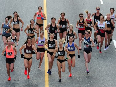 Natasha Wodak (in the No. 2 bib) leads the pack at the start of the 2019 Sun Run along Georgia Street in Vancouver on April 14, 2019.
