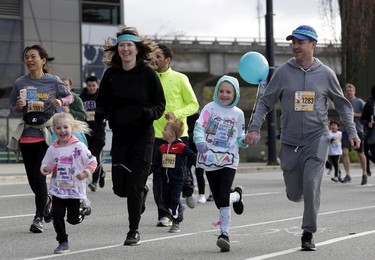 Mini Sun Run participants lead the way for the older folks at the 35th annual Vancouver Sun Run in Vancouver on Sunday, April 14, 2019.