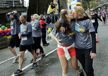 We did it! A couple celebrates after completing The Vancouver Sun Run on Sunday, April 14, 2019.