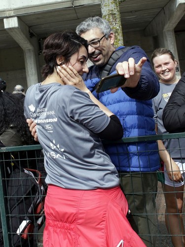A Vancouver Sun Run participant gets some help with her post-race selfie at the 35th annual Sun Run on Sunday, April 14, 2019.