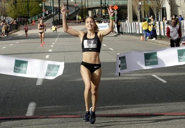 Natasha Wodak of North Vancouver crosses the finish line to win the women's event at the 35th annual Vancouver Sun Run in Vancouver on Sunday, April 14, 2019.