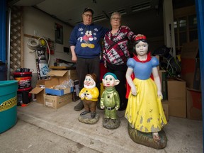 Bjorn and Cindy Storness-Bliss with the remaining gnomes (and Snow White) at their home in Cloverdale.