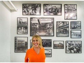 Jacqui Cohen of the Army & Navy in Vancouver on April 30 in front of vintage photos of the Army & Navy's history.