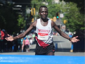 Daniel Kipkoech crosses the finish line in first place at the 2016 BMO Vancouver Marathon.