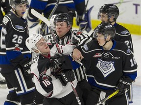 Vancouver Giants' Davis Koch (16) and the Victoria Royals' Tarun Fizer (18) rough it up during Game 3 of the WHL playoffs last spring.