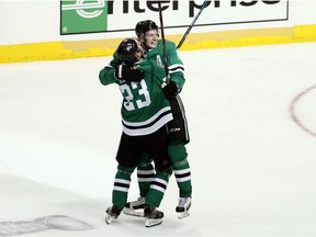 Dallas Stars' Esa Lindell (23) celebrates with John Klingberg after Klingberg scored in overtime against the Nashville Predators in Game 6 of an NHL hockey first-round playoff series in Dallas, Monday, April 22, 2019. The Stars won 2-1 in overtime.