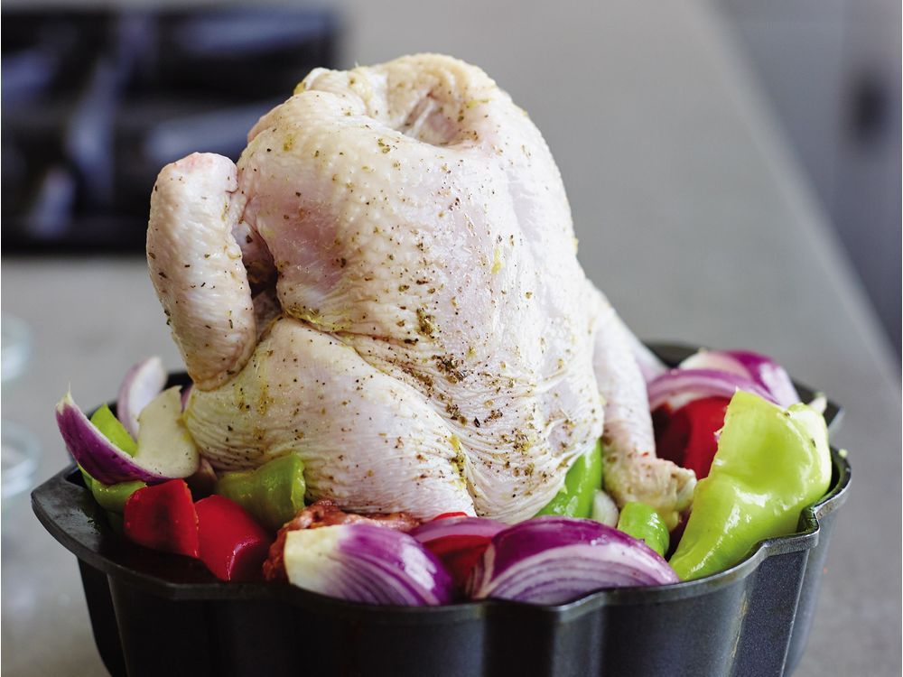  Using a Bundt pan as a vertical roaster allows the chicken to get brown and crisp all around and its juices to moisten the vegetables below.