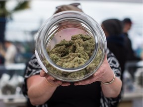 A vendor displays marijuana for sale during the 4-20 annual marijuana celebration in Vancouver on Friday, April 20, 2018.