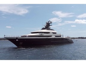 FILE - In this Feb. 28, 2018, file photo, the luxury yacht Equanimity is seen in the Benoa harbor in Bali, Indonesia. Malaysia's government says a luxury yacht allegedly bought with money stolen from the multibillion-dollar looting of a state investment fund will be sold to casino operator Genting Berhad for $126 million, half its original price. Attorney-General Tommy Thomas says the Admiralty Court on Wednesday, April 3, 2019, approved the sale of the Equanimity, which has lavish amenities including a helicopter landing pad, plunge pool, gymnasium and a cinema.