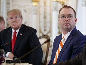 U.S. President Donald Trump and acting White House chief of staff Mick Mulvaney during a meeting at Mar-A Lago in Palm Beach, Fla., on March 22, 2019.