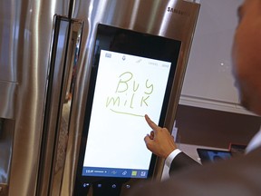 An employee demonstrates the memo-writing facility on a Samsung Electronics Co. Family Hub fridge/freezer inside the Smart Home section at a John Lewis Plc department store in London on April 8, 2016. We know security standards are needed to prepare for the spread of IoT. In the very near future, data tracking and gathering will be ubiquitous with our daily life.