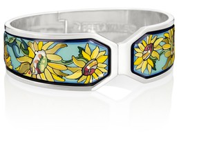 The colours of the sunflowers are beautifully interpreted in hues of yellow and orange with warm 24 karat gold fire enamel.