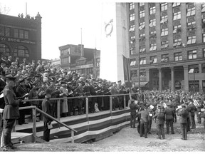 Unveiling of the cenotaph at Victory Square on Apr. 27. 1924, showing  the viewing stand at the ceremony. Twenty-five thousand people attended the ceremony. Stuart Thomson/Vancouver Archives AM1535-: CVA 99-1218.