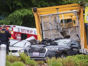 Emergency crews work the scene of a construction crane collapse near the intersection of Mercer Street and Fairview Avenue near Interstate 5 in Seattle, on Saturday, April 27, 2019. Authorities say several people have died and a few others are hospitalized after the construction crane fell onto a street in downtown Seattle Saturday afternoon.