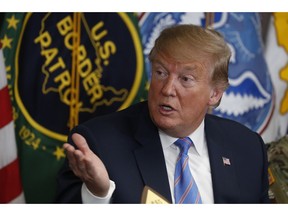 In this April 5, 2019 photo, President Donald Trump participates in a roundtable on immigration and border security at the U.S. Border Patrol Calexico Station in Calexico, Calif. Trump said Friday he is considering sending "Illegal Immigrants" to Democratic strongholds to punish them for inaction-- just hours after White House and Homeland Security officials insisted the idea was dead on arrival.