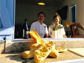 Joy Road Catering's Dana Ewart (left) and assistant Bridget Kristensen at the Sunday Al Fresco Vineyard Dinners at God's Mountain Estate.