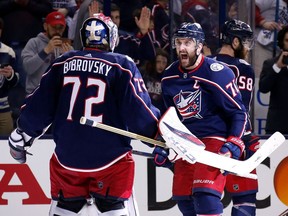 Nick Foligno of the Columbus Blue Jackets congratulates netminder Sergei Bobrovsky after defeating the Boston Bruins 2-1 in Game 3 of the Eastern Conference semifinal on April 30, 2019 at Nationwide Arena in Columbus, Ohio. The series is now tied 2-2, with Game 5 in Boston.