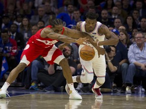 Kawhi Leonard of the Toronto Raptors and Jimmy Butler of the Philadelphia 76ers fight for the ball in the fourth quarter of Game 4 of the Eastern Conference semifinal at the Wells Fargo Center on May 5, 2019 in Philadelphia, Pennsylvania. The Raptors defeated the 76ers 101-96. (Photo by Mitchell Leff/Getty Images)