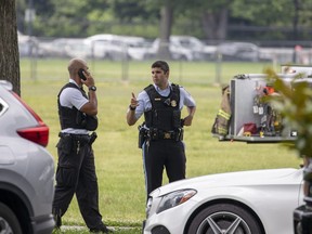 Law enforcement monitors the scene where a man set himself on fire on the Ellipse near 15th and Constitution Avenue on May 29, 2019 in Washington, D.C.