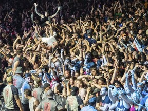 Festival-goers crowd-surf at the Sonic Temple Art and Music Festival at Mapfre Stadium on May 18 in Columbus, Ohio.