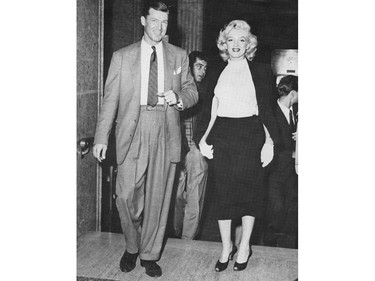 Photographer Ray Munro (left) with Marilyn Monroe and Rory Calhoun (back) at the Hotel Vancouver in the 1950s.