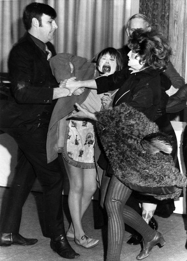 March, 1970: Security guards at the Hotel Vancouver eject a woman who burst into a fashion show attended by members and guests of the CP Air ex-stewardess club and dumped animal dung. Photo ran in The Vancouver Sun on March 10, 1971.