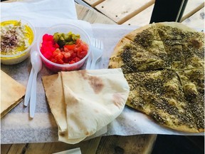 Zaatar manoush'eh flatbread and sbanekh at Manoush'eh.