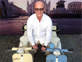 Backed by a blow-up of Duomo di Milano cathedral, Ross Bonetti increased the La Dolce Vita flavour of his Italianate Livingspace store’s expansion party by straddling his two classic Vespa scooters.