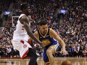 Toronto Raptors' Pascal Siakam guards against Golden State Warriors' Klay Thompson during Thursday's game. (JACK BOLAND/Toronto Sun)