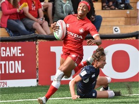 Canada's Charity Williams evades USA's Lauren Doyle to score a try during HSBC World Rugby Womens Sevens action in Langford on Sunday, May 12, 2019.
