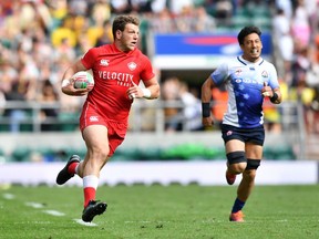Canada's Adam Zaruba runs in a try during the rugby union sevens pool match between Canada and Japan on the first day of the London 2019 World Rugby Sevens Series event at Twickenham Stadium in west London on May 25, 2019.