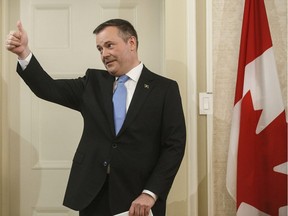 New Alberta Premier Jason Kenney gives the thumbs up as he is sworn in Edmonton on Tuesday, April 30. He wasted no time telling B.C. Premier John Horgan his stance on pipelines was not just campaign rhetoric.