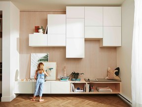 Ikea's Besta cabinetry used to provide maximum vertical storage in family apartment