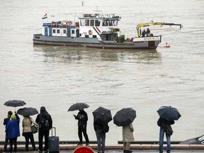 A sonar is being used at Margaret Bridge during a search operation on the River Danube in Budapest, Hungary, Thursday, May 30, 2019, following a collision of a hotel ship and a smaller cruise ship on the previous evening. (Balazs Mohai/MTI via AP)