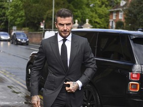 Football star David Beckham arrives at Bromley Magistrates Court for a hearing after he was spotted using his mobile phone while driving his Bentley, in London, Thursday, May 9, 2019. The magistrate has the power to impose six penalty points and a £200 fine for the charge of using a mobile while driving.
