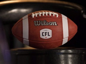 A football with the new CFL logo sits on a chair in Winnipeg, Friday, Nov. 27, 2015. (THE CANADIAN PRESS/John Woods)